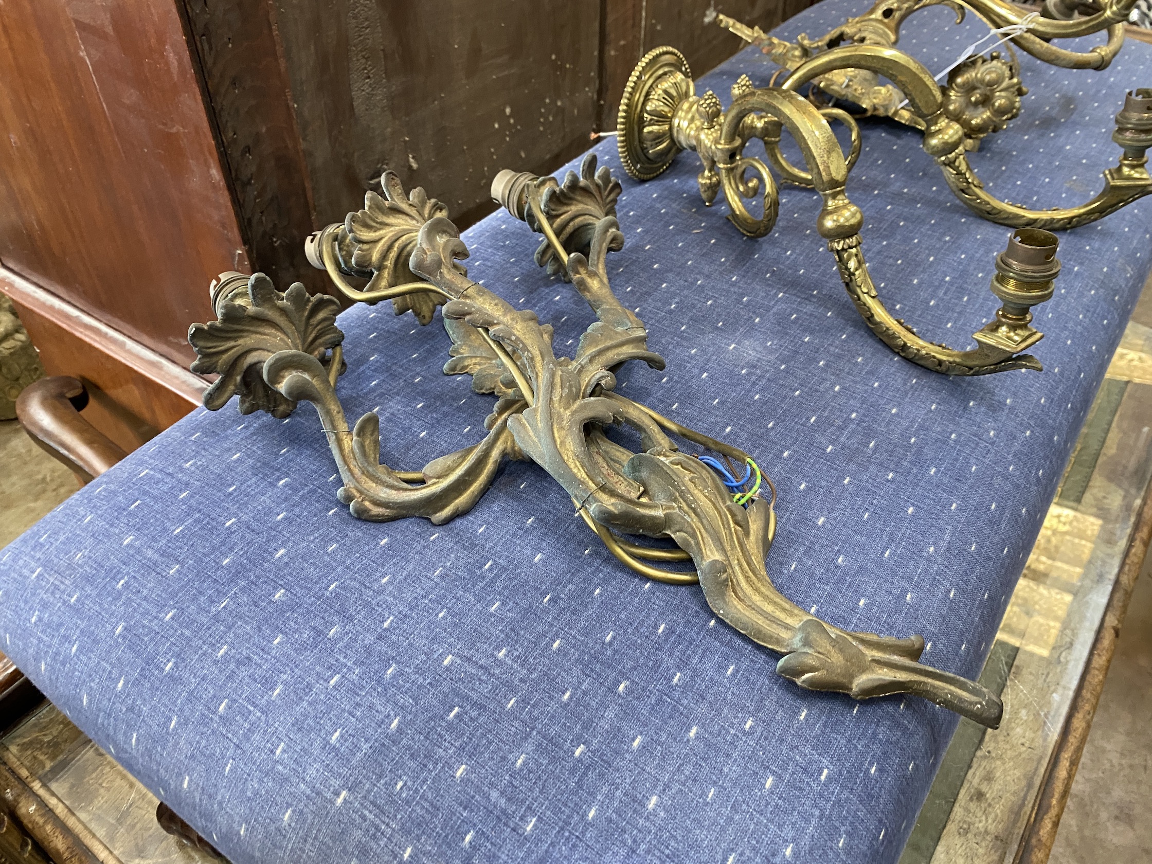 Three gilt metal wall lights, tallest 46cm